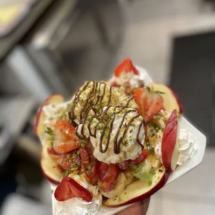 a person holding a plate of food