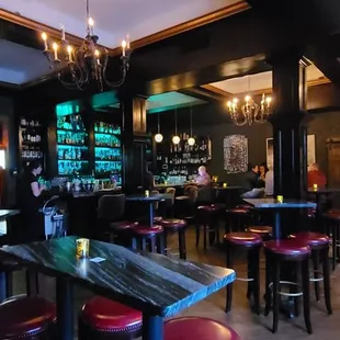a bar with red stools