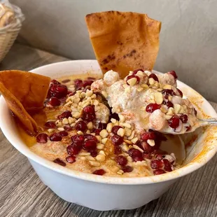 a bowl of food with chips
