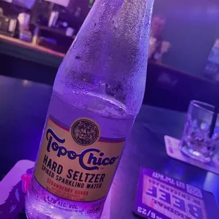 a bottle of hard seltzer on a table