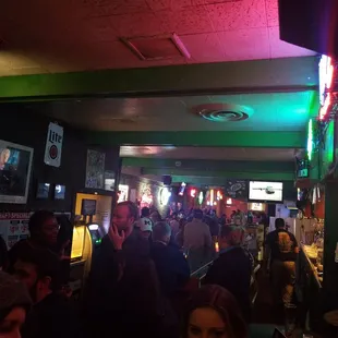 a crowd of people at a bar