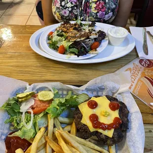 a woman sitting at a table with a plate of food