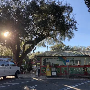 a parking lot with a white van parked in front of it