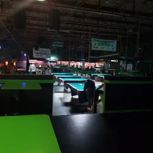 a pool table and pool tables in a large room