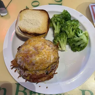 Porkroll sandwich with cheddar on a burger bun.