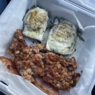 Over hard eggs, corned beef and bacon - missing sausage that was supposed to come with it.