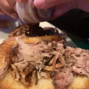 My Husband&apos;s embarrassing pulled pork sandwich. Tiny &amp; dry. He had to ask for more bbq sauce. Limited amount of pork meat, so sad.