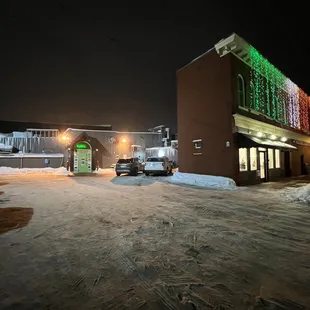 a snowy street at night
