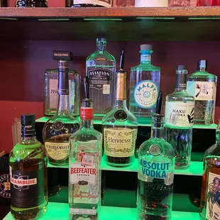 a shelf of liquor bottles