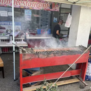 Cooking the kabob outdoor with real charcoals