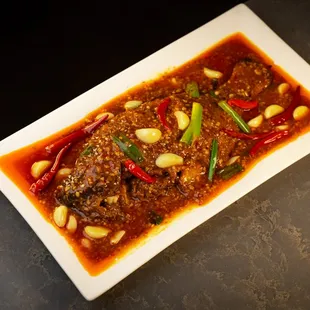 Our Restaurant signature dash. Tilapia braised with garlic, spicy bean paste, and vinegar, take 25 min to prepare.