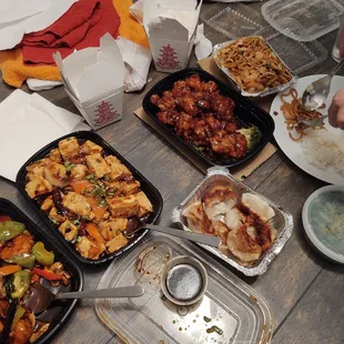 a table full of chinese food