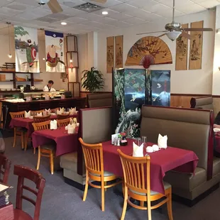 people sitting at tables in a restaurant