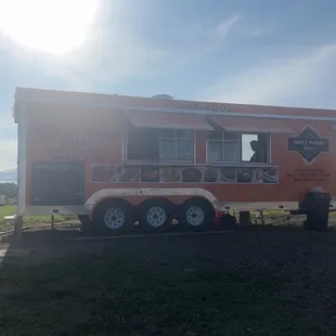 ows an orange food truck
