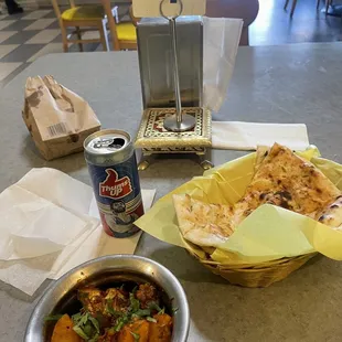 Aloo ghobi, garlic naan, and a thumps up drink