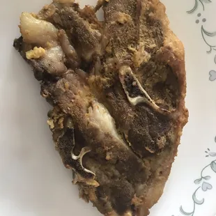 a slice of pizza on a plate