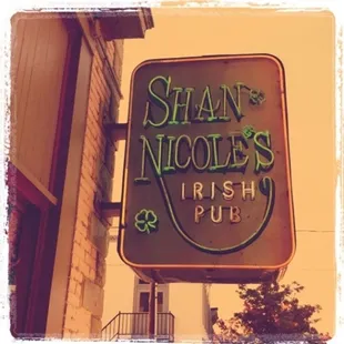 a neon sign for a irish pub
