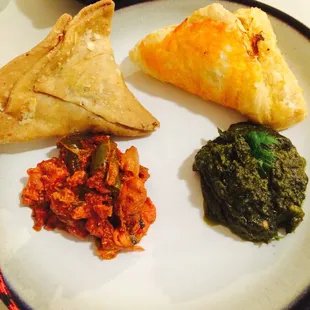 Samosas (top left) Chicken Puff Pastry (top right) Frontier Chicken (bottom left) Saag (bottom right)