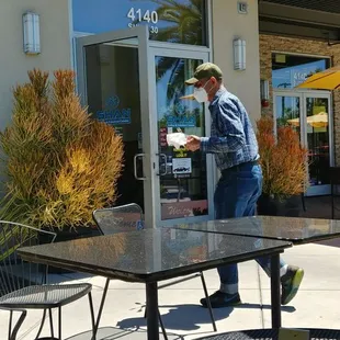 a man walking out of the door