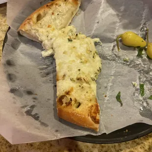 a slice of pizza with olives