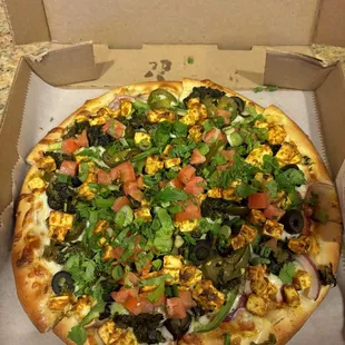 size small Palak Paneer Pizza (10 inch) - toppings were put on THIQUE