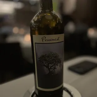 a bottle of wine on a plate