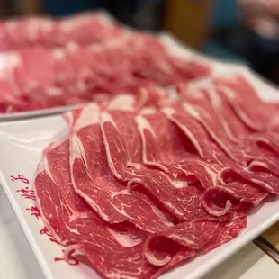  a plate of raw beef