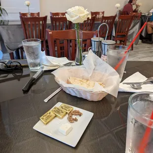 Complementary cheese, bread, butter, and walnuts