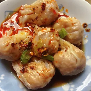 Spice up your day with our Sichuan Spicy Chicken Wontons! Each bite is a burst of flavor, combining tender chicken and fiery Sichuan spices