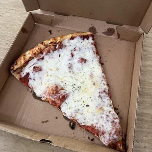 a slice of pizza in a box