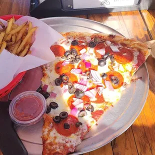 One large slice of pizza fries and a cold beer.