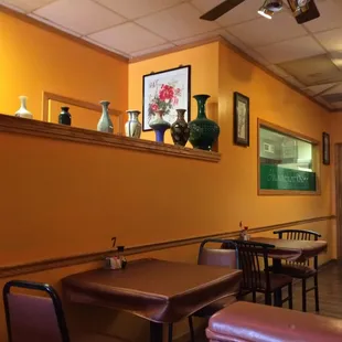 a man sitting at a table in a restaurant