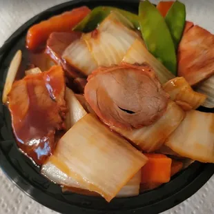 a plate of food with meat and vegetables