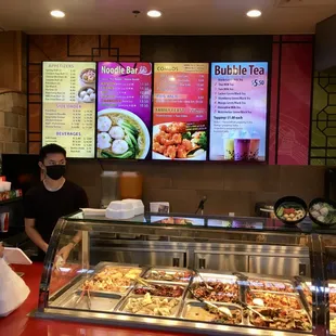 a woman ordering food at a chinese restaurant