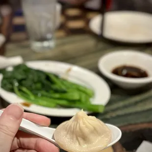 Xiao long bao, badly under-dressed gai lan in background