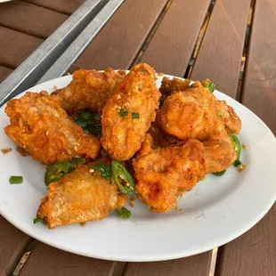 Salt and pepper fried chicken wings . Delicious