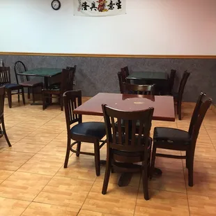 tables, chairs, and a clock