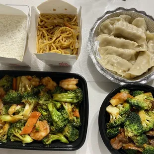 Shrimp and broccoli, beef and broccoli, rice, noodles, dumplings with sauce.