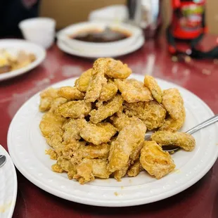 a pile of fried chicken on a plate