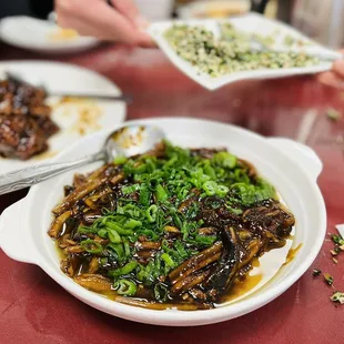 a plate of chinese food being served