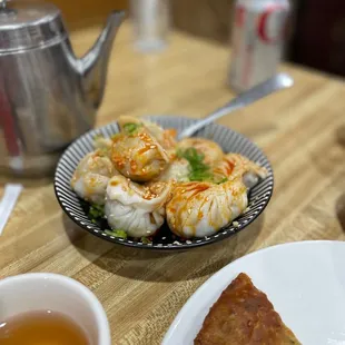 a plate of food and a cup of tea