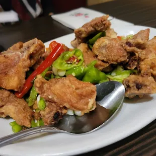 a plate of fried chicken and vegetables