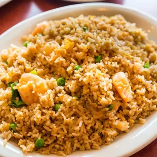 a plate of fried rice with shrimp