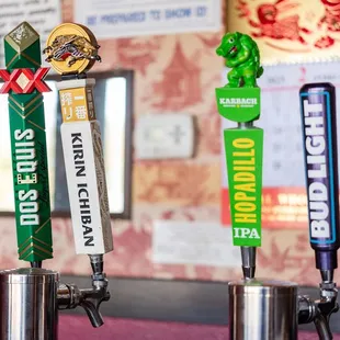 a row of beer taps