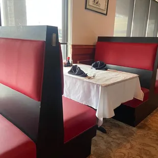 a table and booths in a restaurant