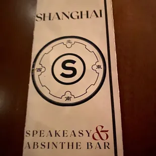 a sign for speakeasy and absinte bar