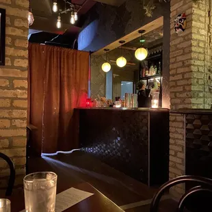 a dimly lit bar in a dimly lit restaurant
