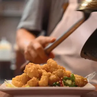 a plate of food being prepared