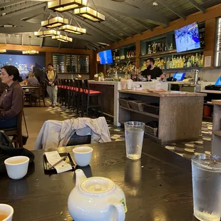 a view of a restaurant with tables and chairs