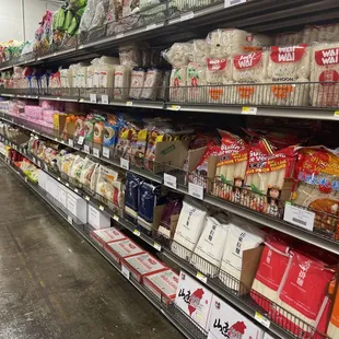 a supermarket aisle with a variety of goods